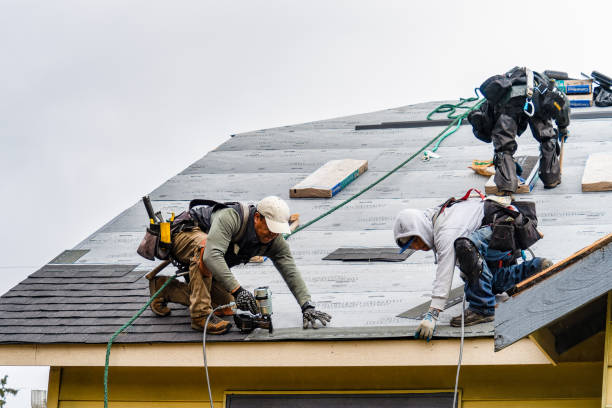 Professional Roofing technician working in Atkins, AR